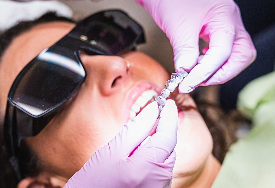 Orthodontist fitting a patient with clear aligners at Smiles Family Dentistry in New Jersey