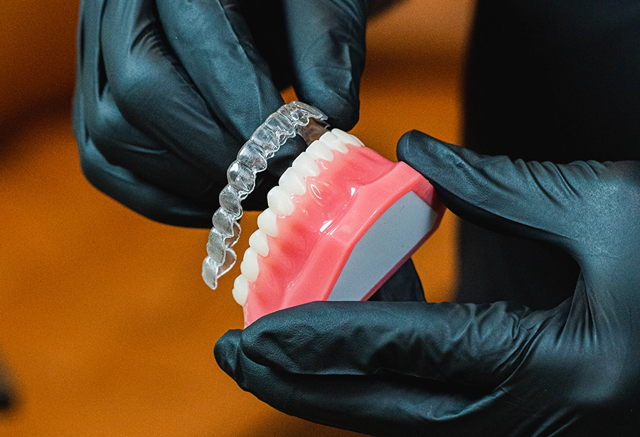 Dentist showing a patient how clear aligner treatment will straighten their teeth